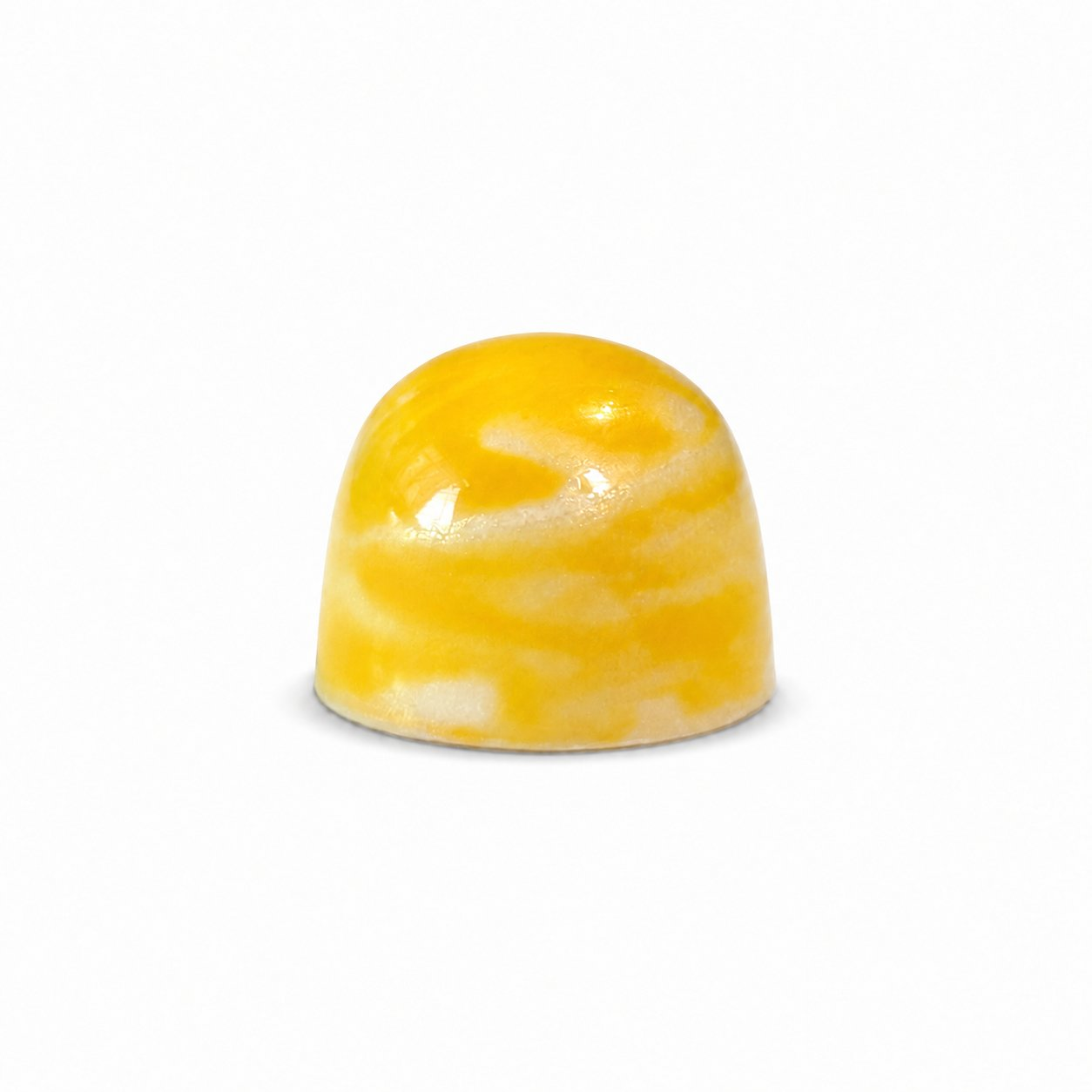 White Lemon chocolate bonbon with pale yellow speckled finish